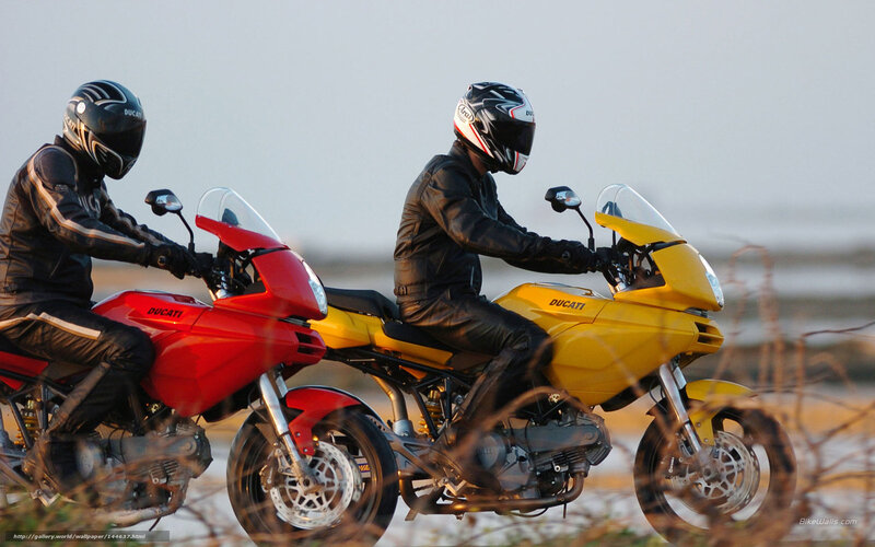 Two Motorcyclists Riding