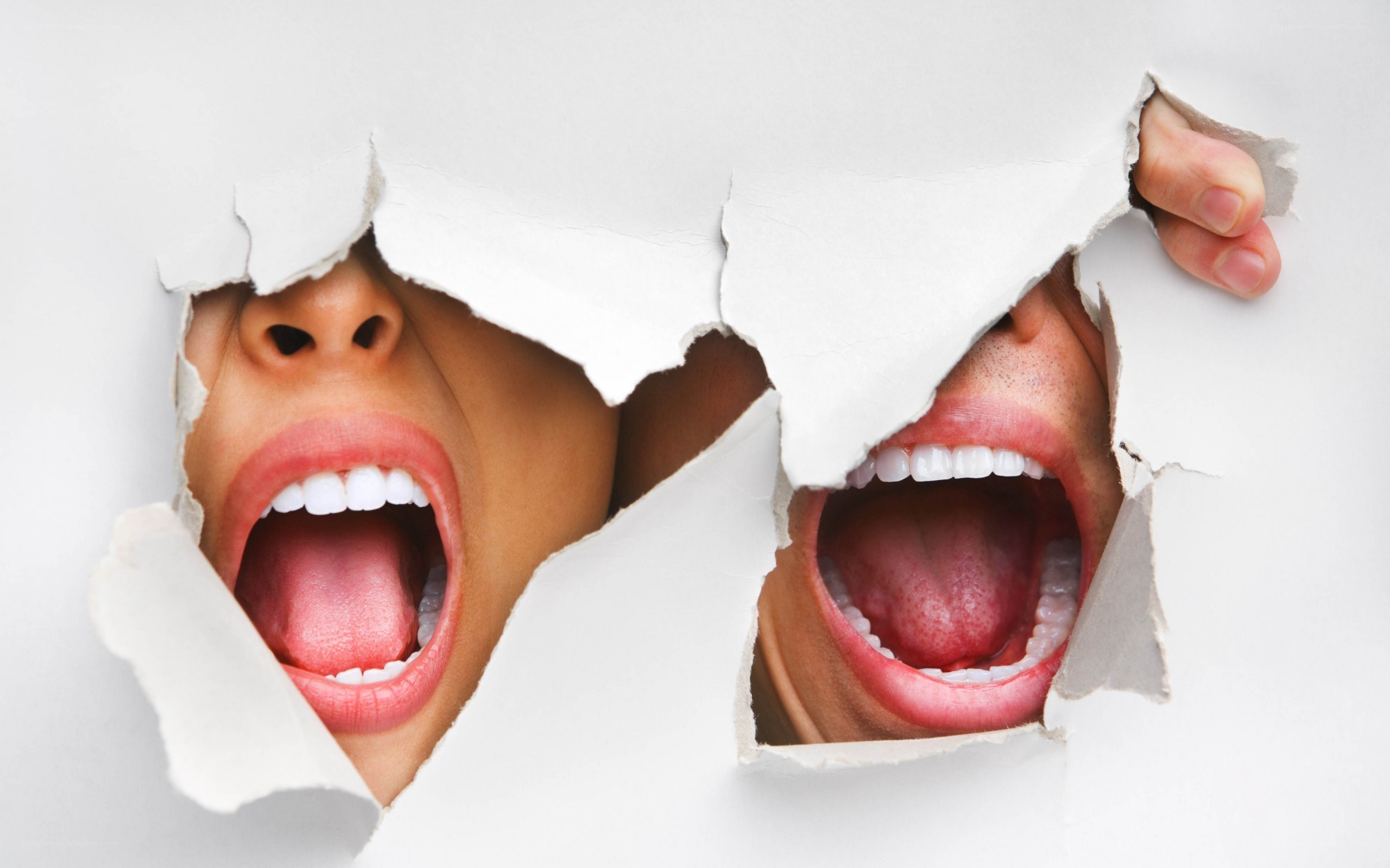 two mouths screaming through paper