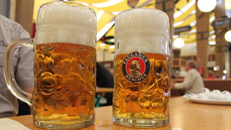 Two mugs of Paulaner beer
