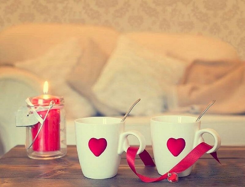 Two Mugs with Candles