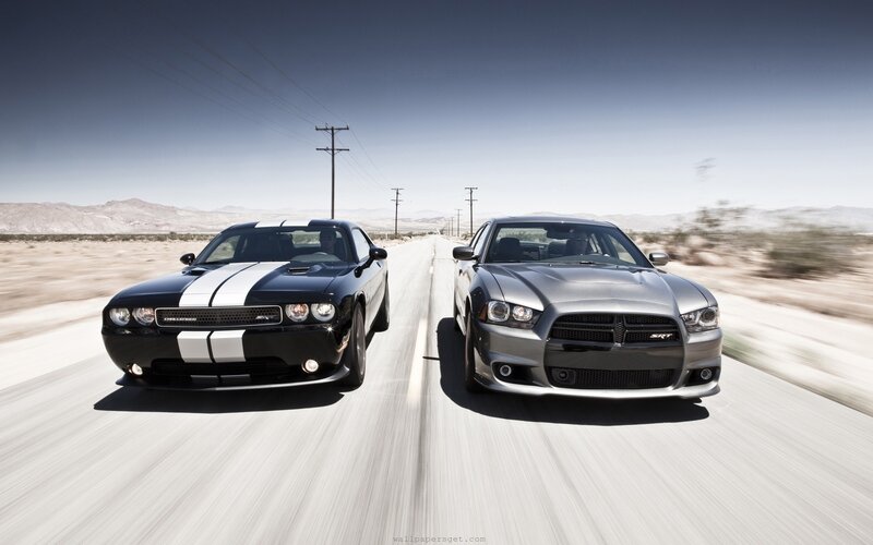 Two Muscle Cars on Road — Black