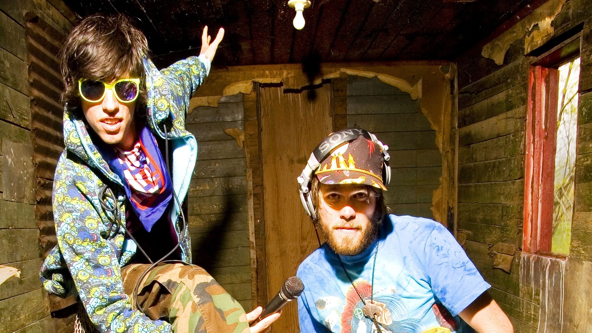 Two musicians in a rustic shed