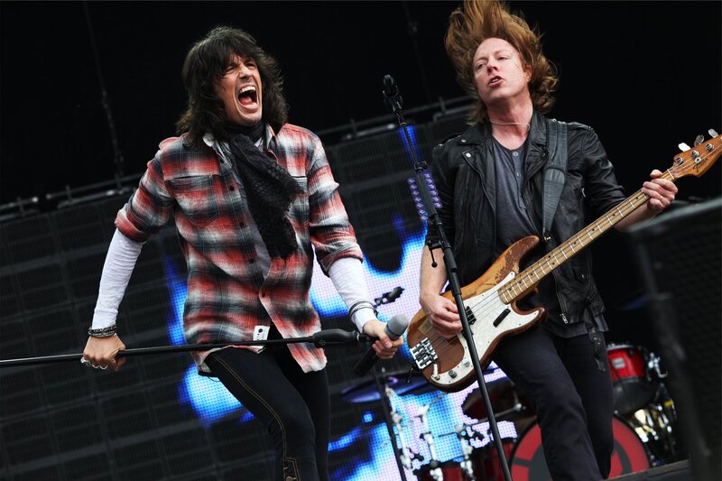 Two Musicians on Stage — Black, Energetic, Photograph