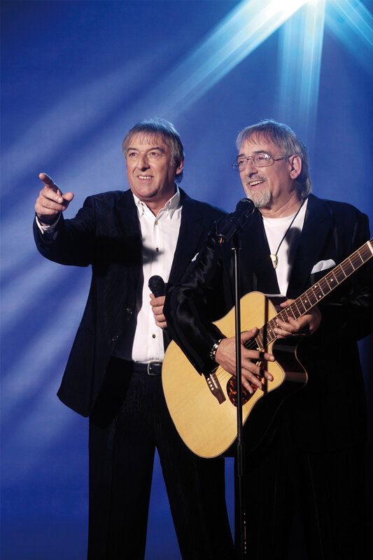 Two musicians on stage performing