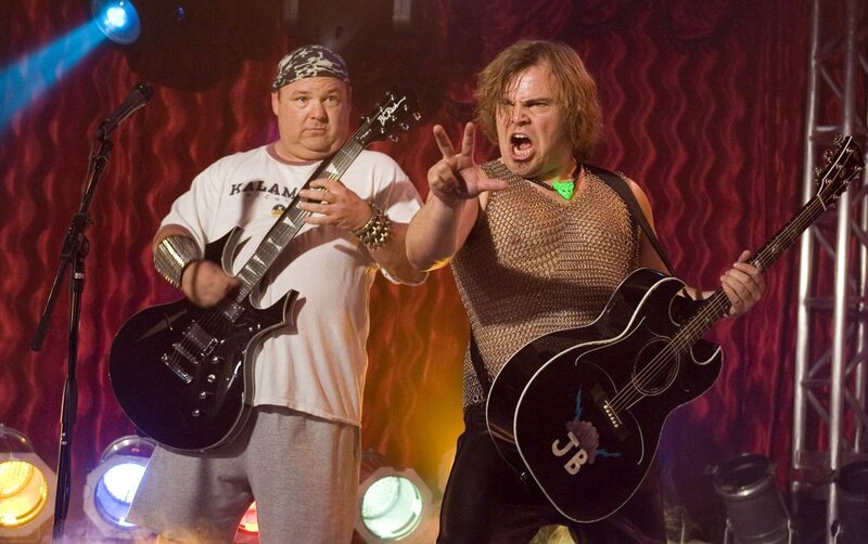 Two musicians on stage performing