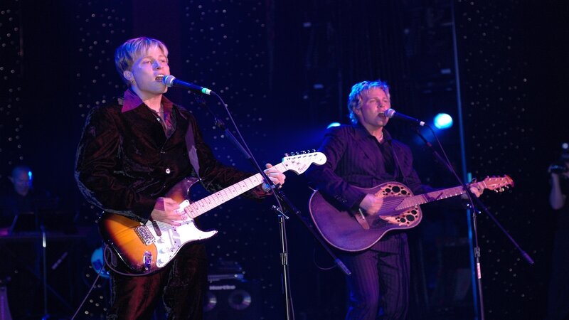 Two musicians performing on stage