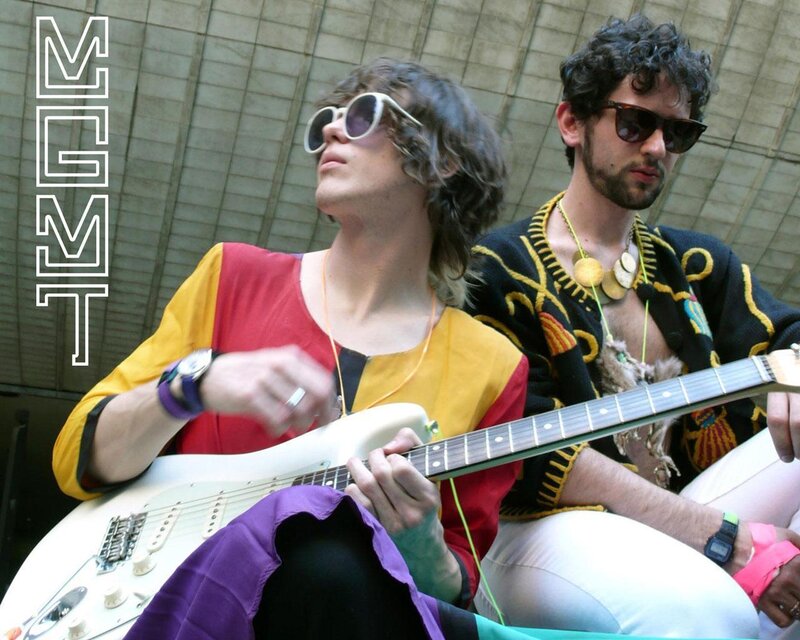 Two musicians playing guitar