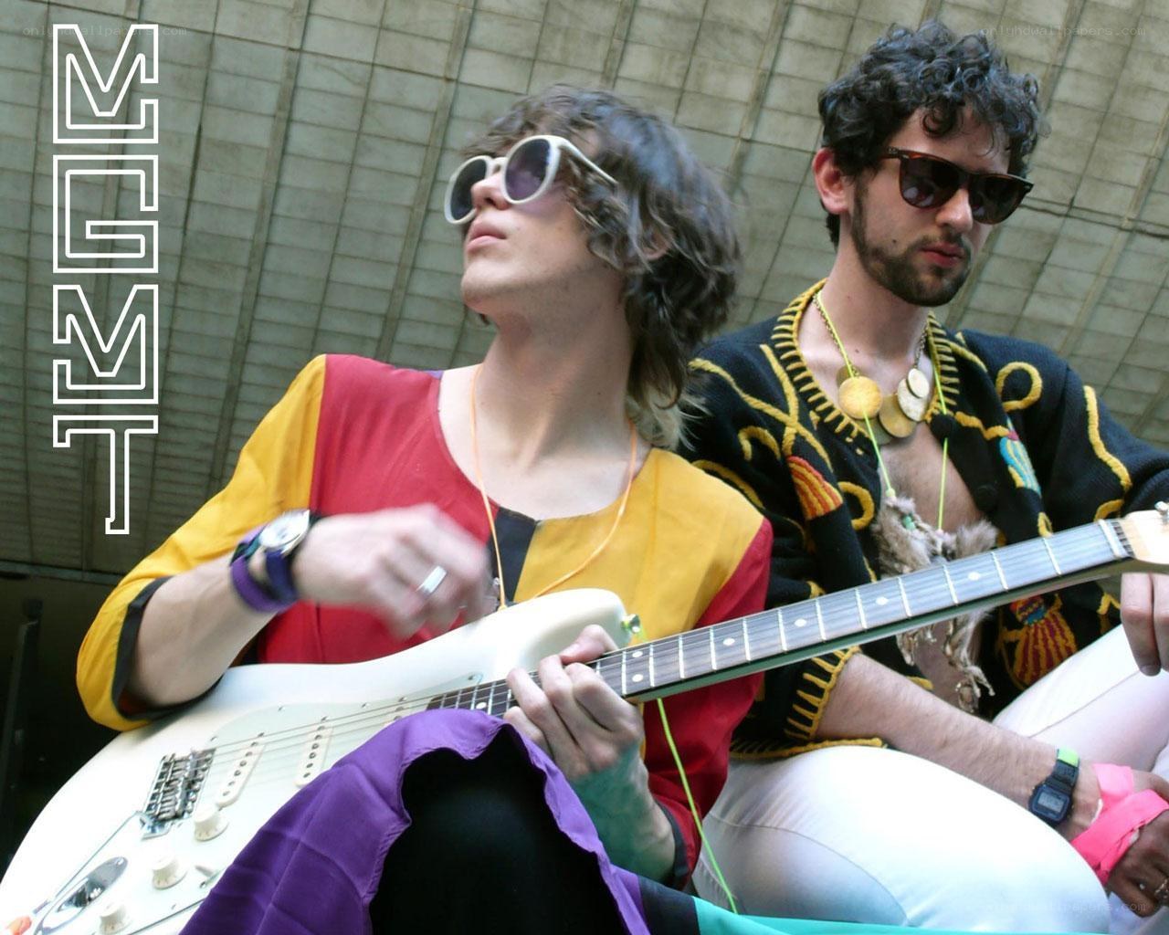 Two musicians playing guitar