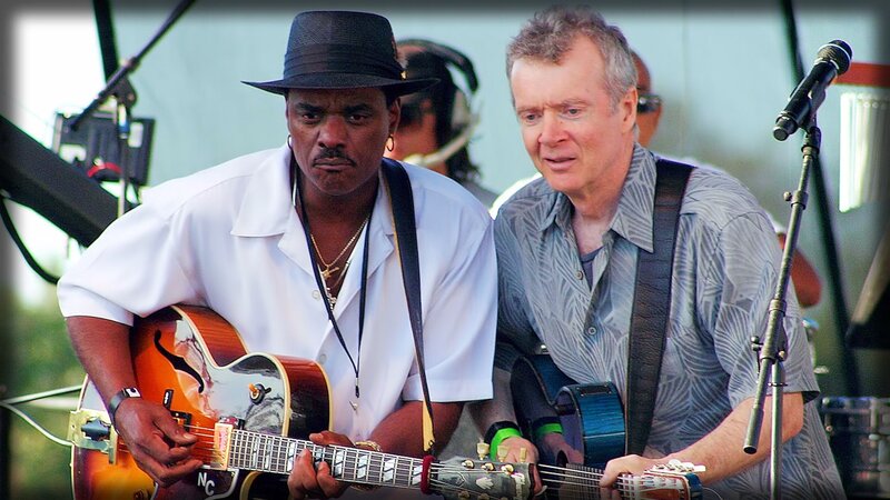 Two Musicians Playing Guitars — White