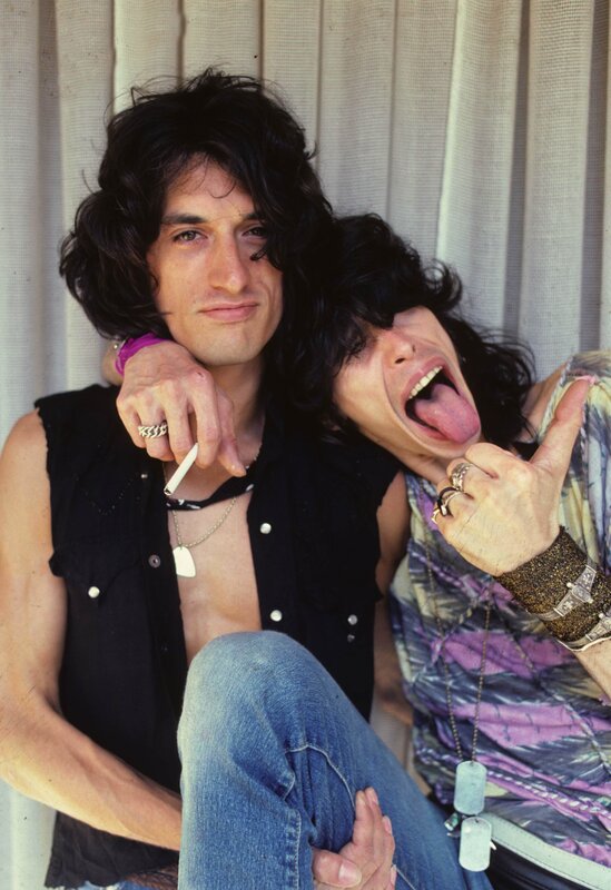 Two musicians posing together