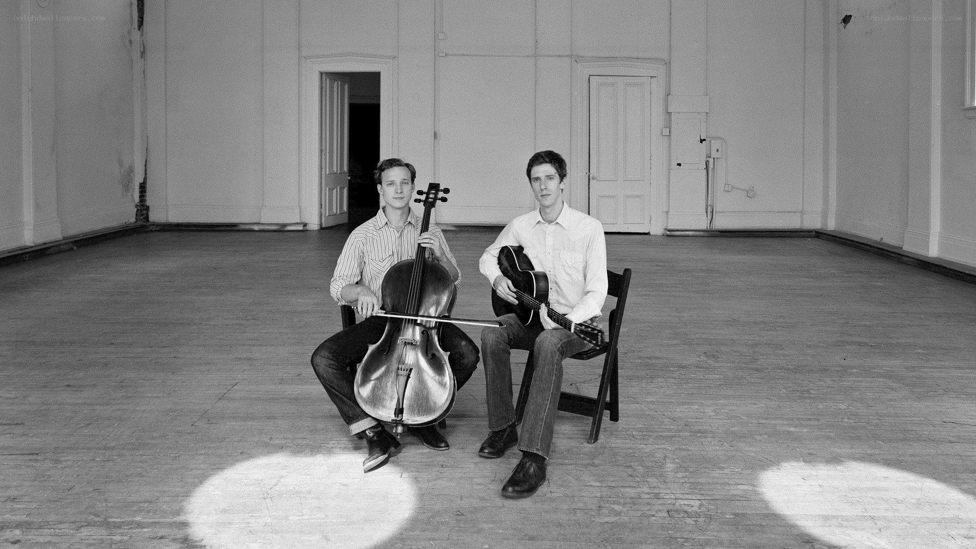 Two musicians with cello and guitar