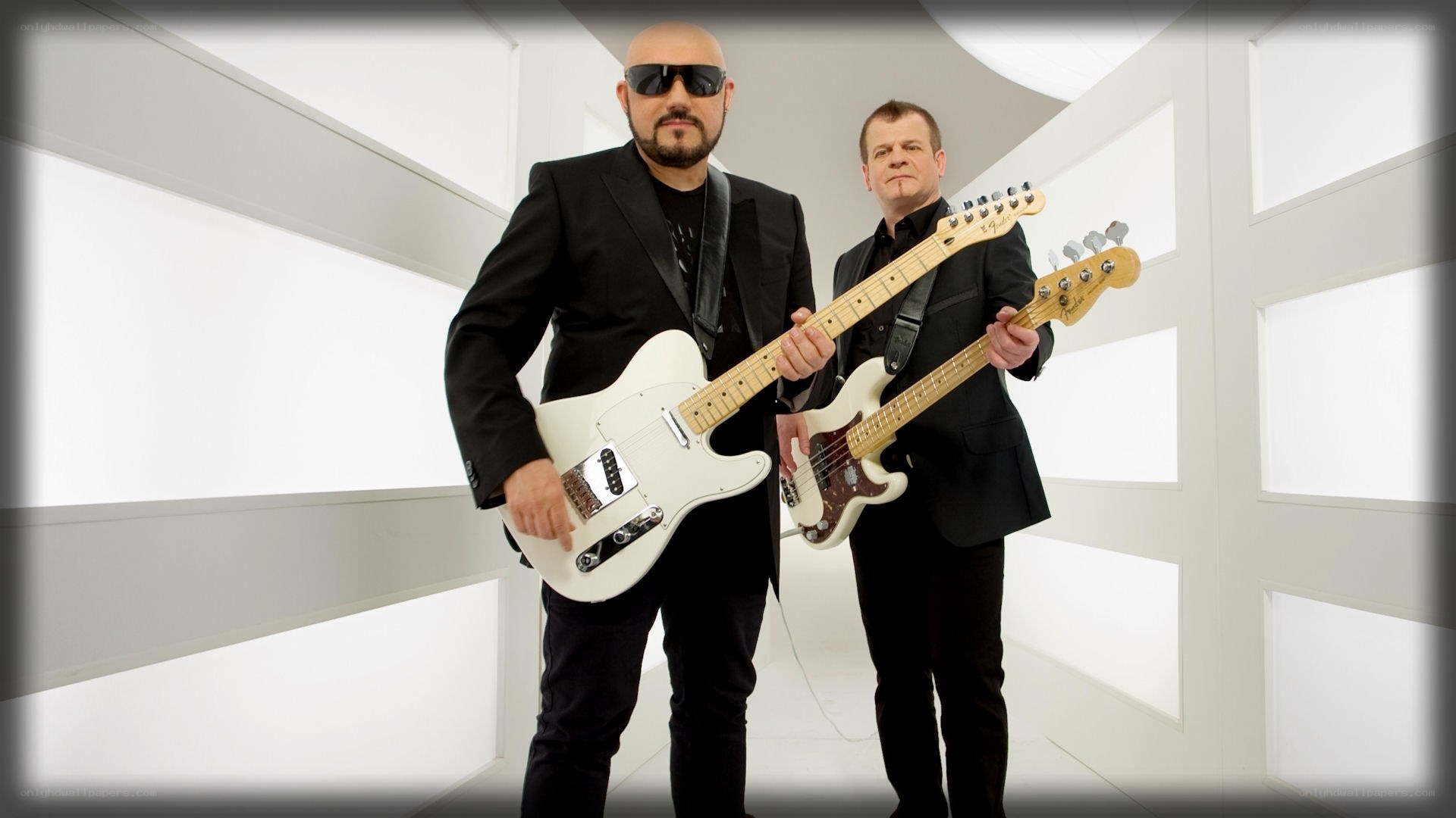 Two musicians with guitars