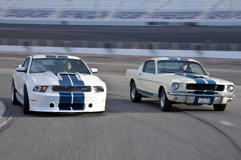 Two Mustangs racing on track