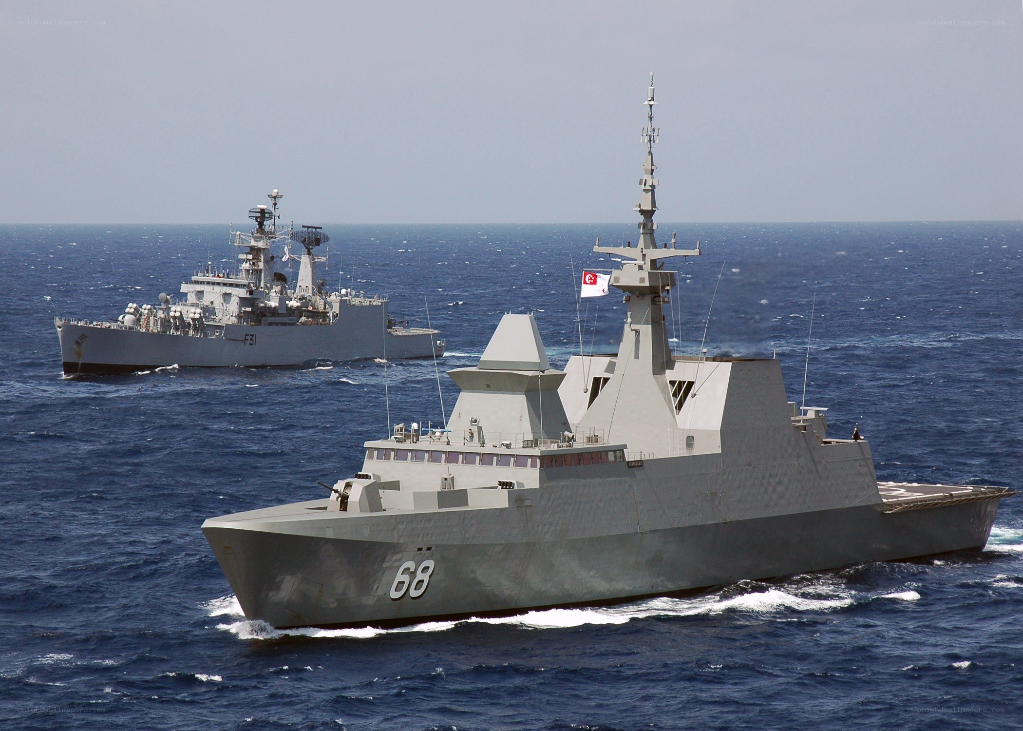 Two naval ships at sea