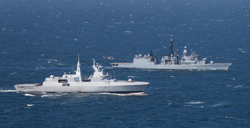 Two Naval Ships at Sea — Blue, Calm, Afternoon