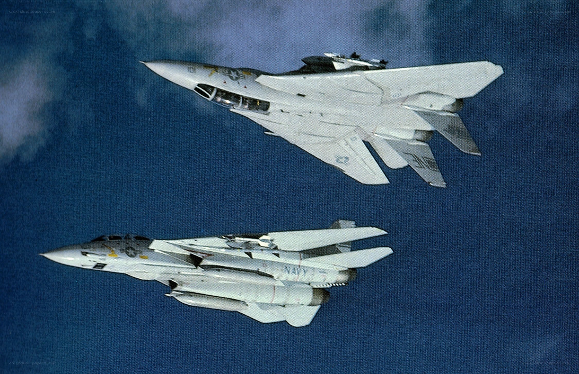 Two Navy fighter jets in flight