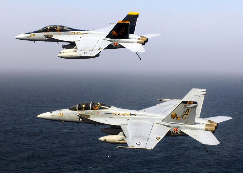 Two Navy fighter jets in flight