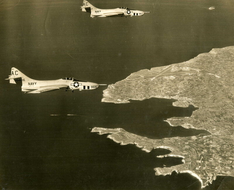 Two Navy jets over coastline