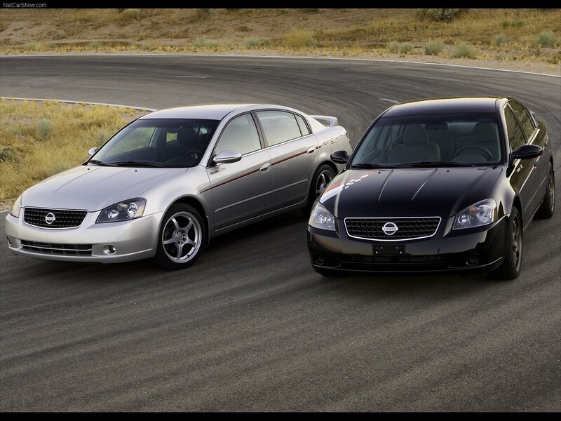 Two Nissan Altima cars on a track