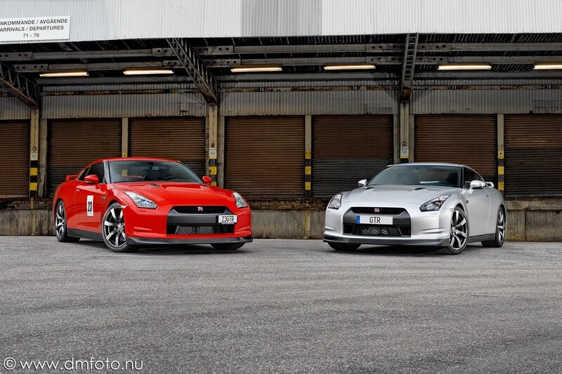 Two Nissan GT-R cars in a garage