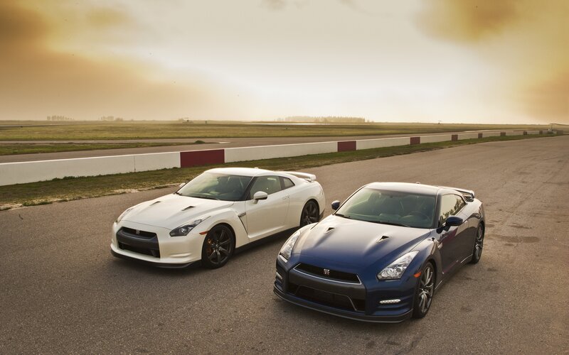 Two Nissan GT-Rs on a racetrack