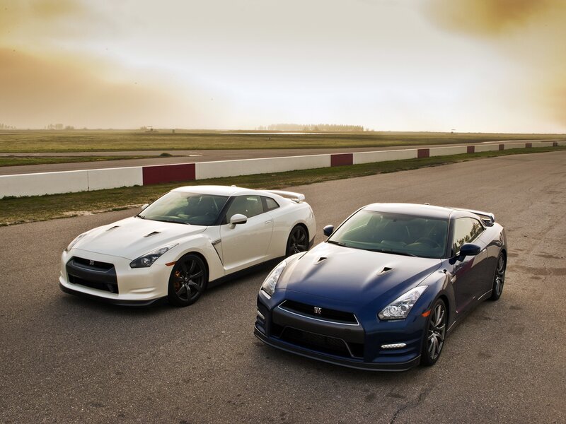 Two Nissan GT-Rs on a racetrack