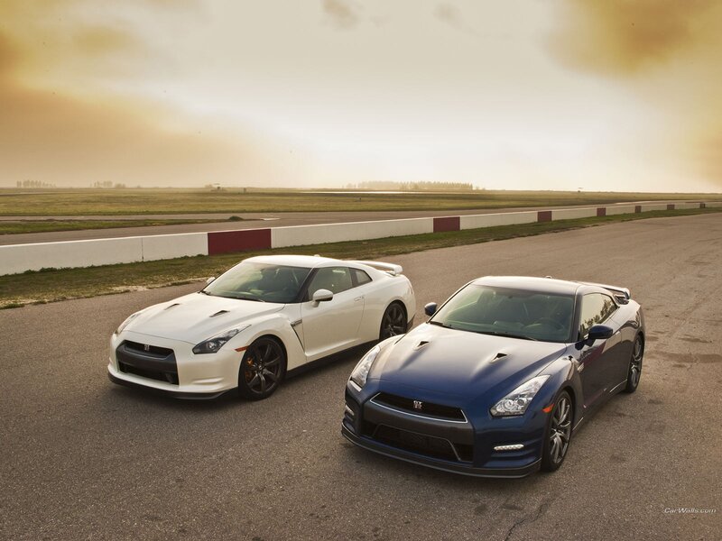 Two Nissan GT-Rs on a racetrack