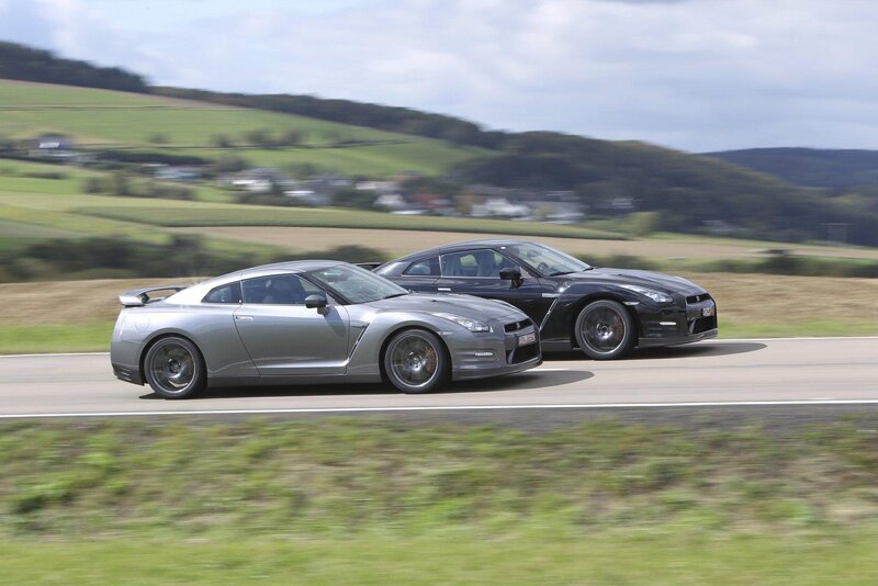 Two Nissan GT-Rs on a road