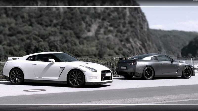 Two Nissan GT-Rs on a road