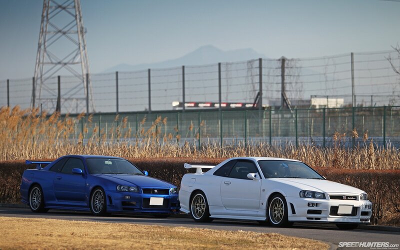 Two Nissan GT-Rs on a track
