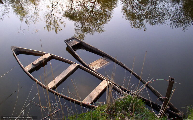 Two old boats on a calm river