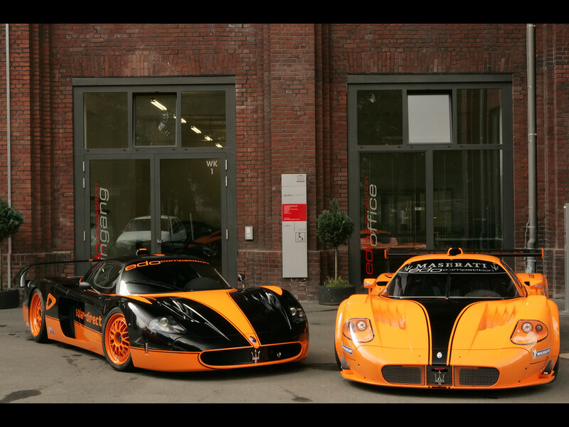Two Orange and Black Race Cars