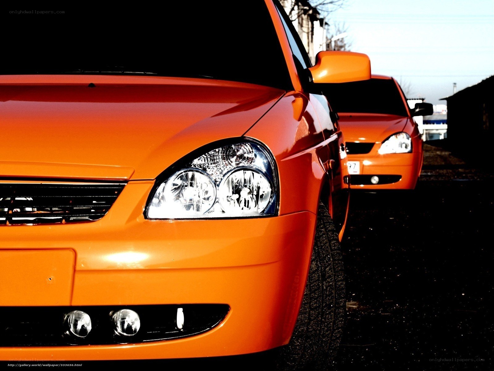 Two orange cars in a row