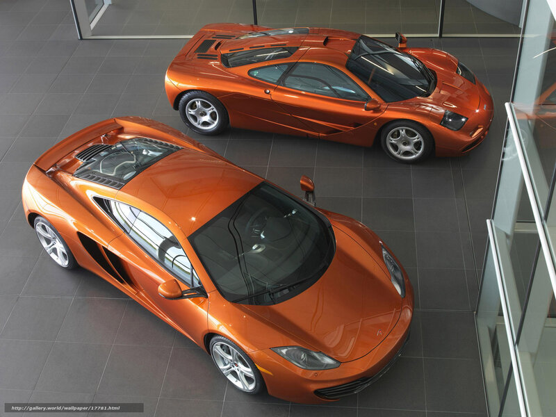 Two orange McLaren sports cars
