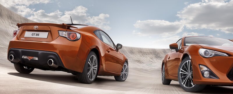 Two orange Toyota GT86 cars