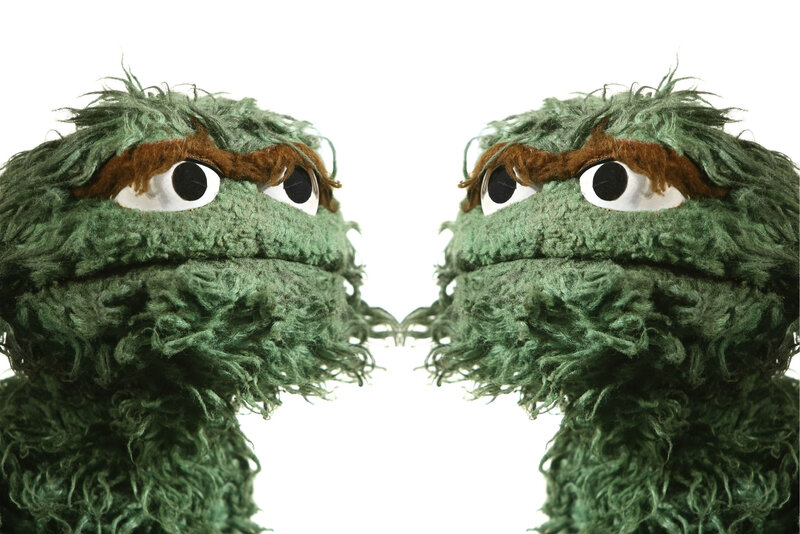 Two Oscar the Grouch puppets