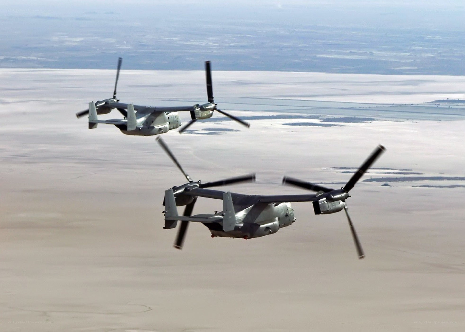 Two Osprey aircraft in flight