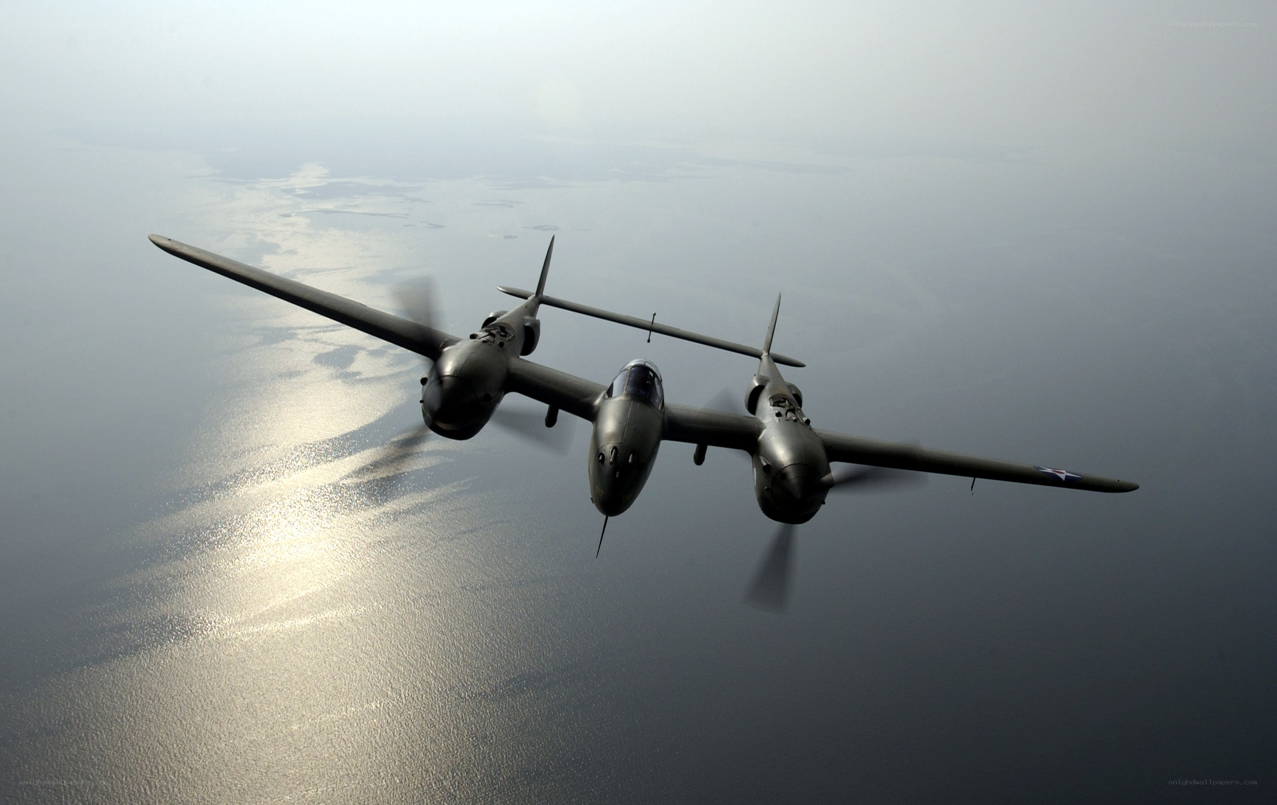 Two P-38 Lightning aircraft in flight