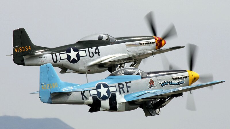 Two P-51 Mustangs in flight