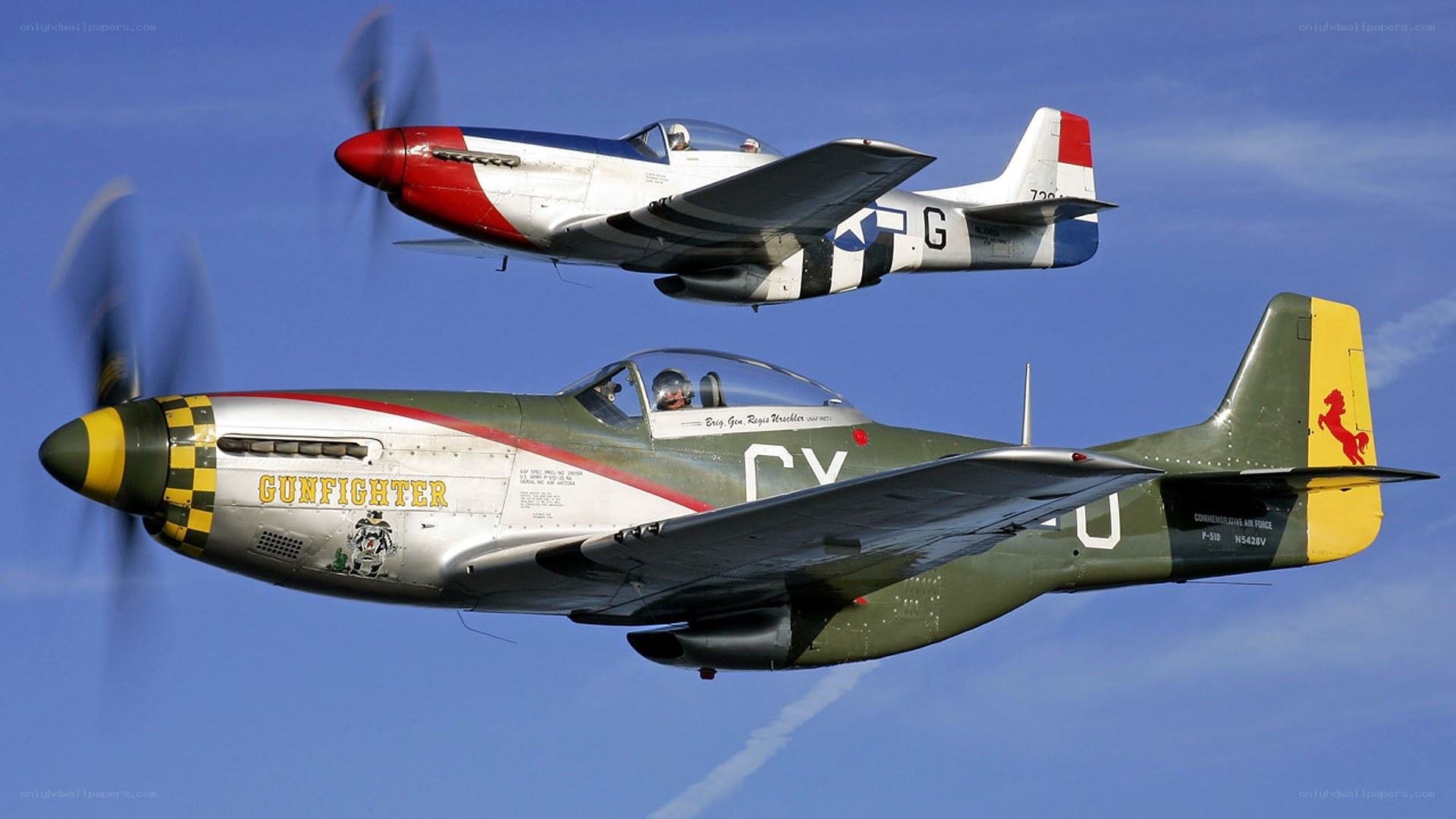 Two P-51 Mustangs in flight