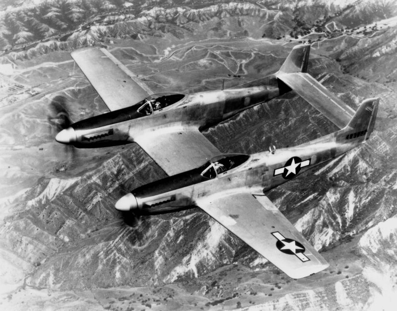 Two P-51 Mustangs in flight