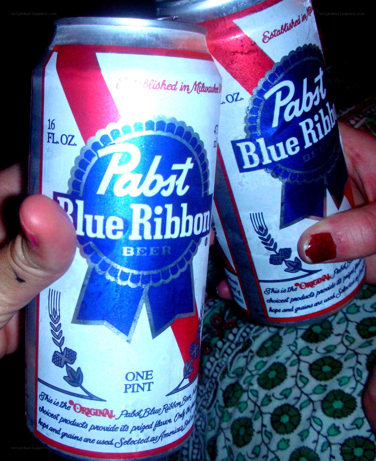 Two Pabst Blue Ribbon cans