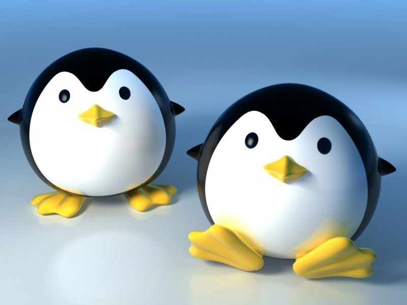 Two Penguin Figurines