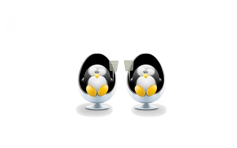 Two penguins in chairs