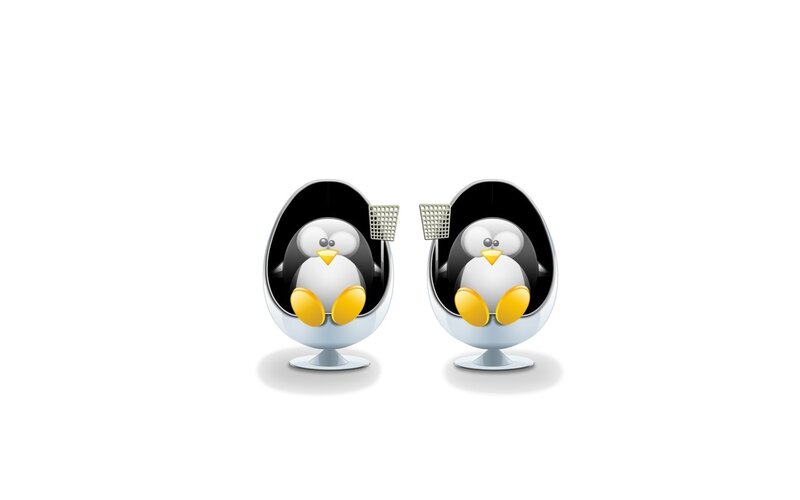 Two penguins in chairs