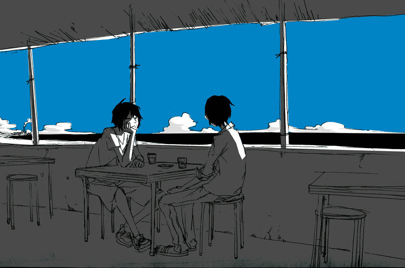 Two people at a seaside table