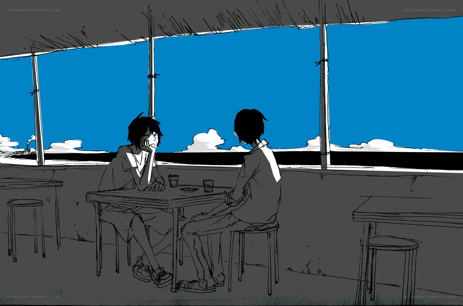 Two people at a seaside table