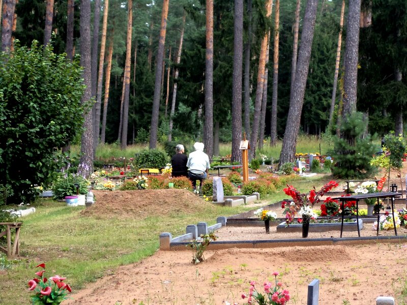 Two People at Gravesite
