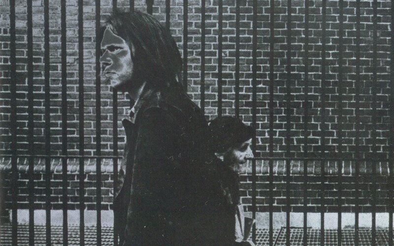 Two People Behind Bars