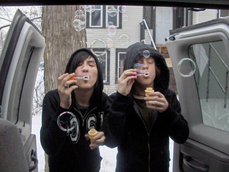 Two People Blowing Bubbles